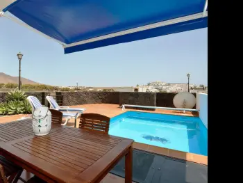 Villa en Playa Blanca,Villa à Playa Blanca : piscine privée, 3 salles de bain, clim, BBQ, proche plages et commodités ES-163-65 N°844445